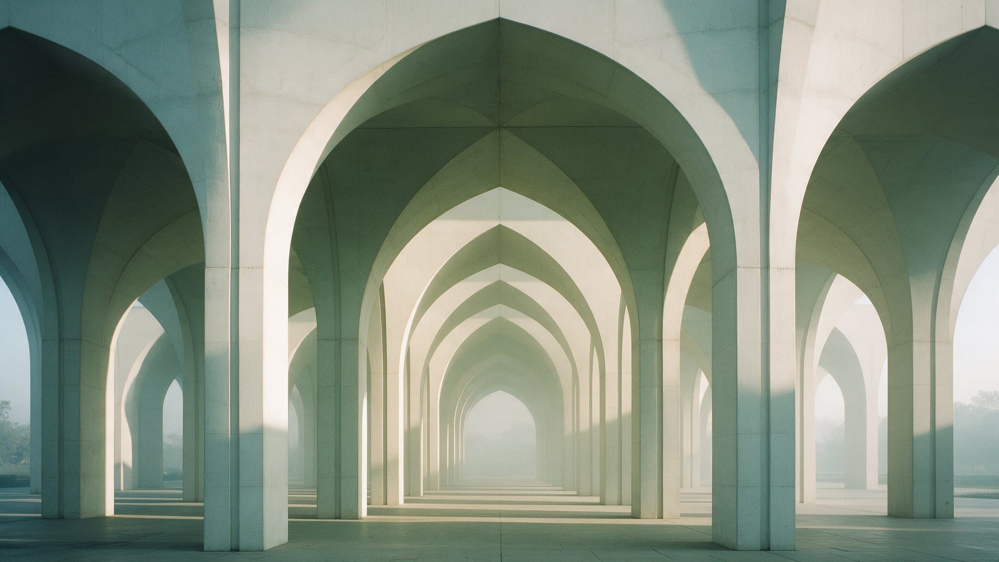Concrete arches receding into morning haze