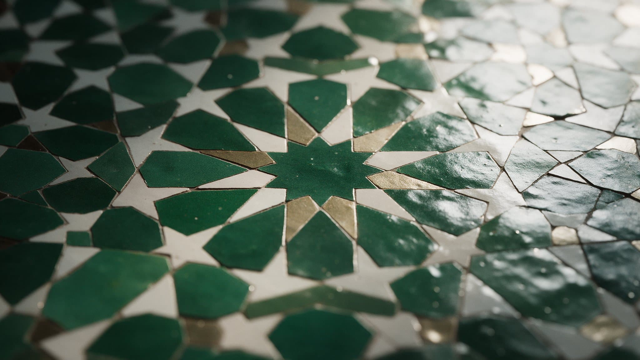 Green and ivory zellige tiles in an eight-pointed star pattern